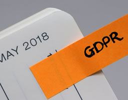 GDPR – a process in its infancy with growing pains – or a big bulge? 2 The corner of a diary page titled "MAY 2018", with a sticky note that reads "GDPR".