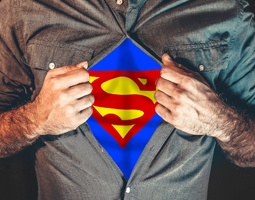 7 Internal marketing ideas to improve employee experiences 15 A torso shot of a man pulling open his shirt to reveal the Superman symbol.