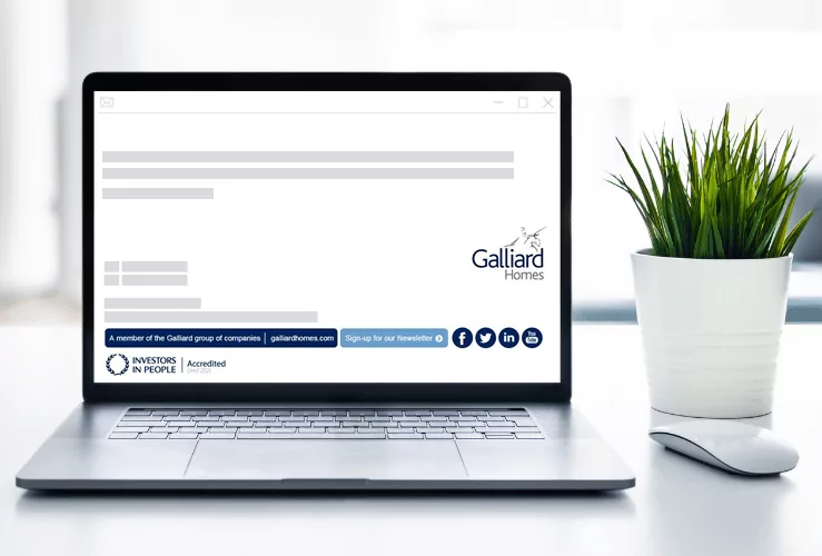 Galliard Holms case study.fw A laptop next to a potted plant, with the Galliard Homes email signature visible on screen.