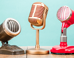 Need More Reviews? How to request (and receive) them with every email… 7 A row of three retro-looking microphones.