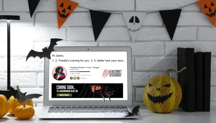 Halloween Email Signature Tips from Top Horror Movie Villains 2 A laptop featuring a Halloween-themed email signature of Freddy Krueger, complete with a spooky banner, set in a Halloween-decorated office.