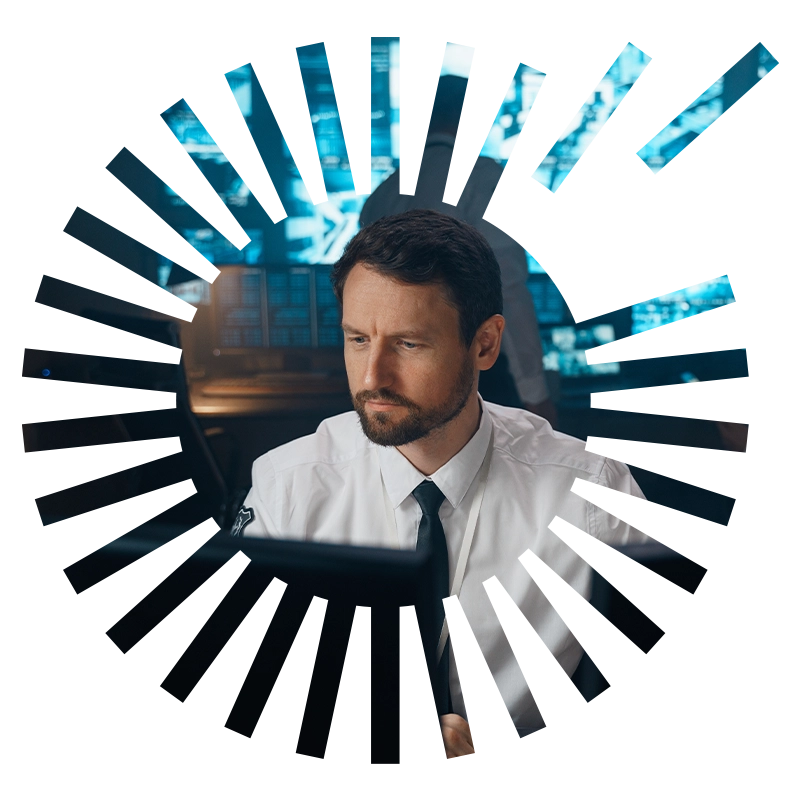 IT Technician Man sitting behind desktop