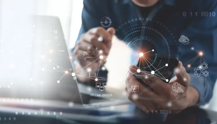 The best MSP add-on services in 2025: why email signature management is essential for growth 7 Software engineer using mobile smart phone and laptop computer with global network connection, Technology, innovative and communication concept for MSP add-on services